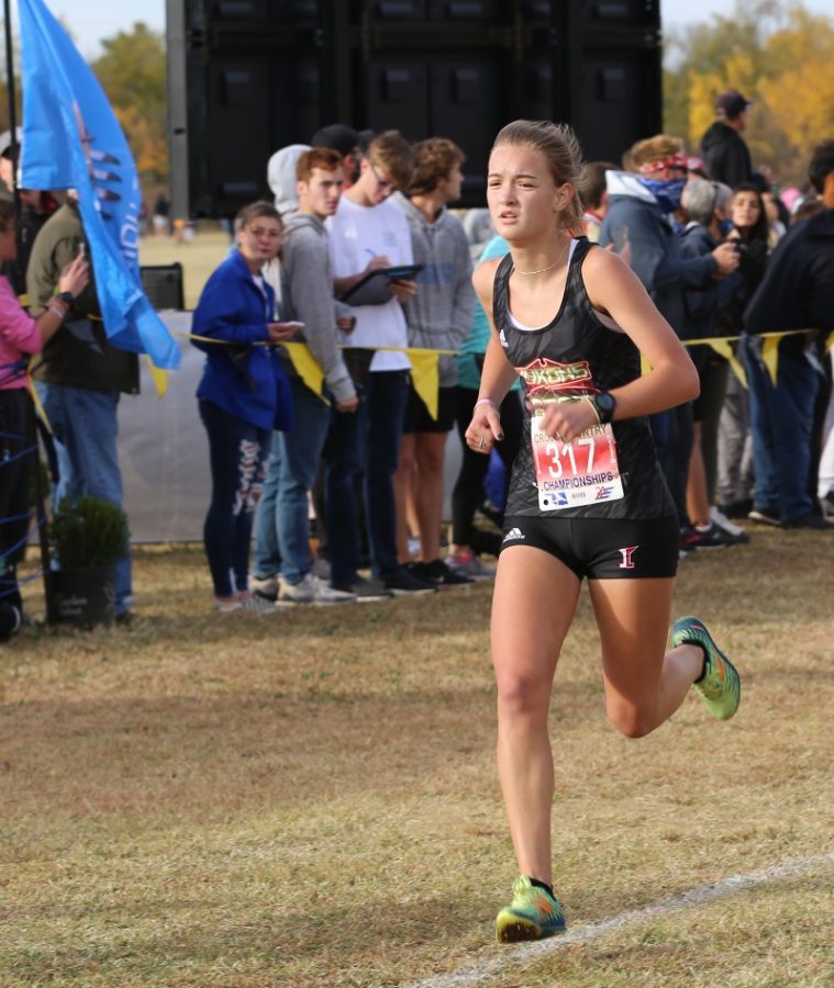 Junior Avery Stanley looks forward towards the finish line at the cross country state meet.