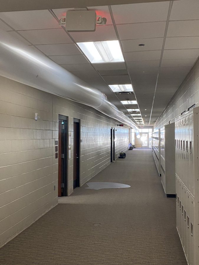 Plastic tubes circulate recycled air from outside to help dry areas affected by water damage. The tubes were connected to a large air unit in the front bus loop on the east side of the school and lined upstairs and downstairs hallways. (Photo by Landon Thomas)