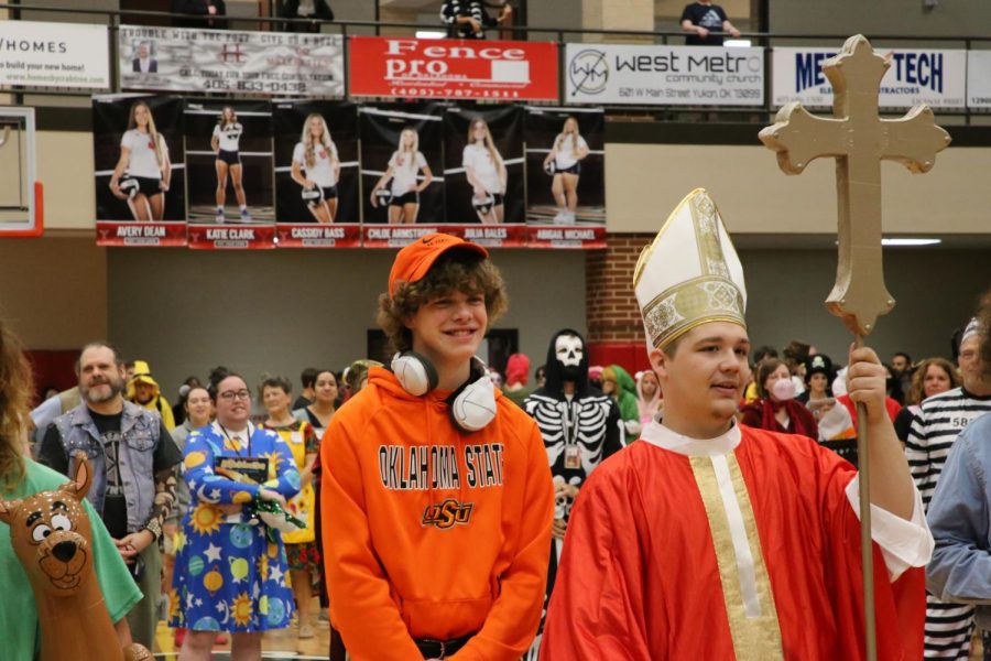 Student and faculty look on as they prepare to hear the results of the competition. Students wore costumes of all types, including a costume modeling Oklahoma State football head coach Mike Gundy, and the Pope.