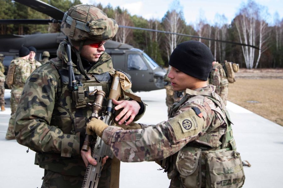 A paratrooper assigned to the Troop B, 5-73 Cavalry, 82nd Airborne Division trains a Polish soldier during a combined training event in Nowa Deba, Poland, Feb. 22, 2022. The 82nd Airborne Division is currently deployed to Poland to train with and operate alongside our Polish allies. The training allows allies to get to know each other’s equipment, capabilities and tactics to enhance readiness and strengthen the NATO alliance.