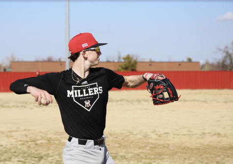 Pitcher Landon Ritchey warming up with his team before pre-season practice.