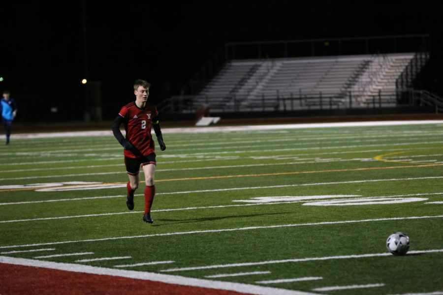Senior defender Jasen Brus races towards a cleared corner during soccers match against Westmoore. After a 4-1 start to the season, the team looks to continue the success in district play.