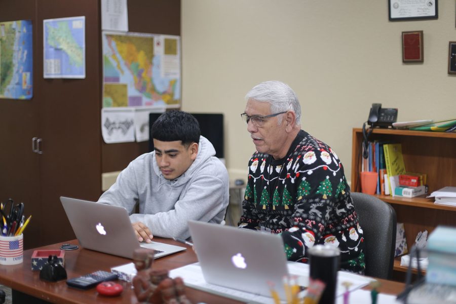 Covering world history, ESL teacher Fernando Zamarripa helps Junior Sebastian Lechuga Garcia widen his knowledge on governmental systems such as the difference between communism and socialism.