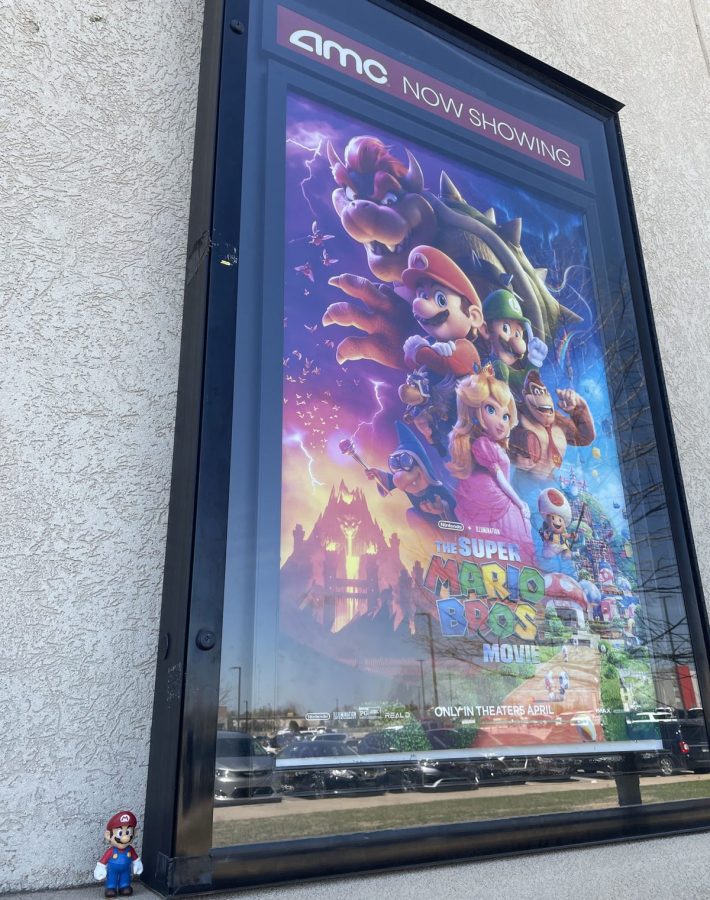 Mario at the movies: A Mario figure poses next to his poster outside of AMC Theaters.