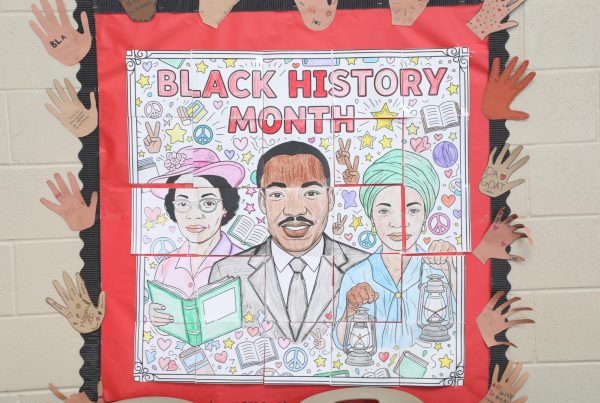 Black excellence. Student members of MSU collaborated on a large, colorful poster of historical African American figures. During the month of February, for Black History Month, the collage hung in the rotunda.