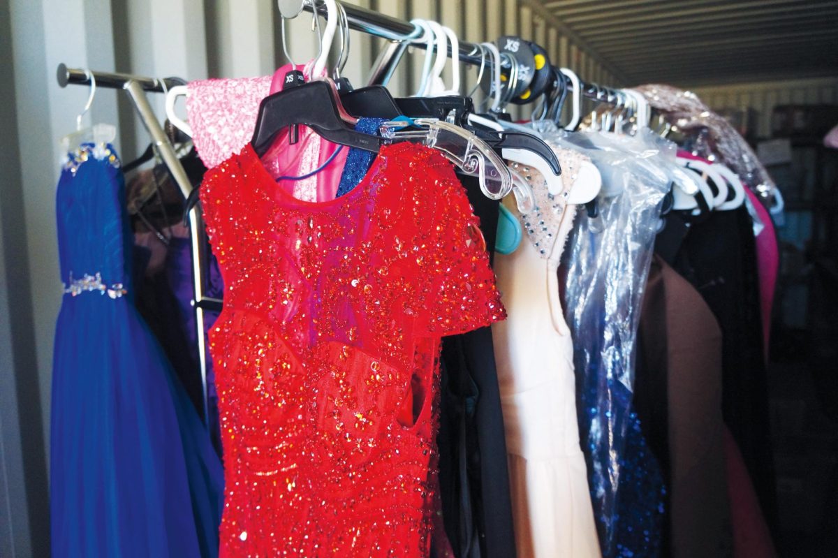 Too much to store. Over 300 dresses sit inside of a shipping container outside of the Woven Boutique. “All of the dresses are donated by people in our community,” Lockhart said.