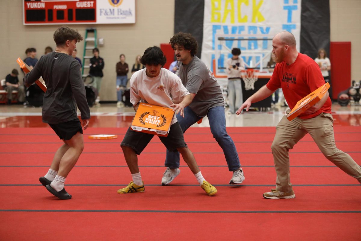 Staying safe. Playing defense, senior Luis Figueroa dodges his opponents to keep himself safe. “You had to knock it forward because if you hit it down it’s not gonna go,” Figueroa said.